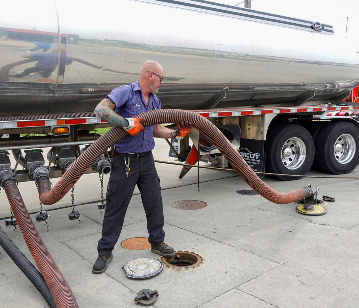 Man Filling Fuel Tanks